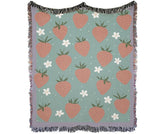 Strawberry woven blanket with pastel green background and fringe